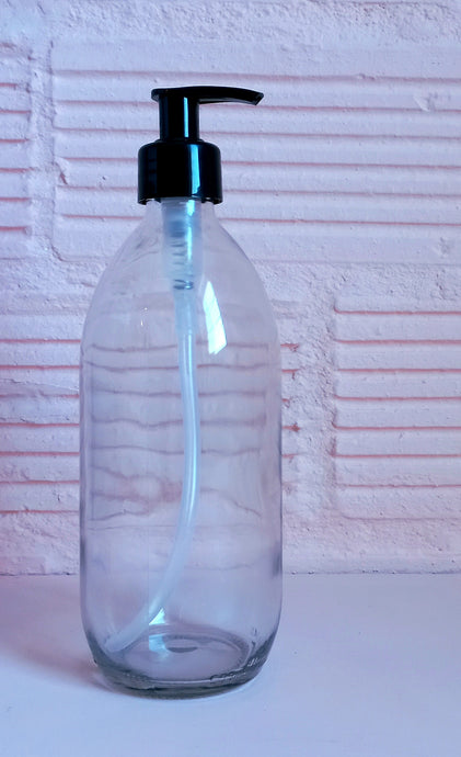 clear glass bottle with black pump dispenser