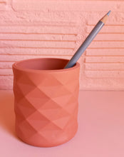 Load image into Gallery viewer, Faceted pen pot in terracotta colour with a pencil in it
