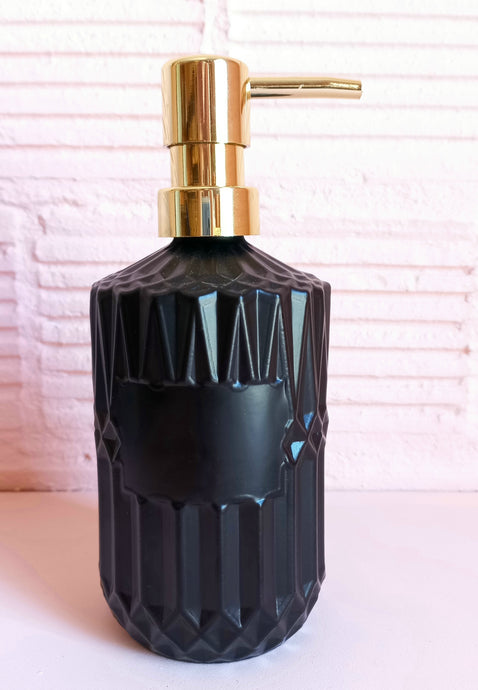 black soap or lotion dispenser with gold lid