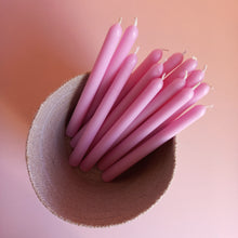 Load image into Gallery viewer, basket full of pink tapered dinner candles
