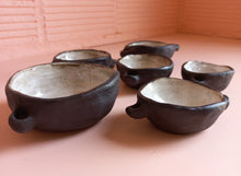 Load image into Gallery viewer, Six stacking ceramic bowls with white inside and matt black outside

