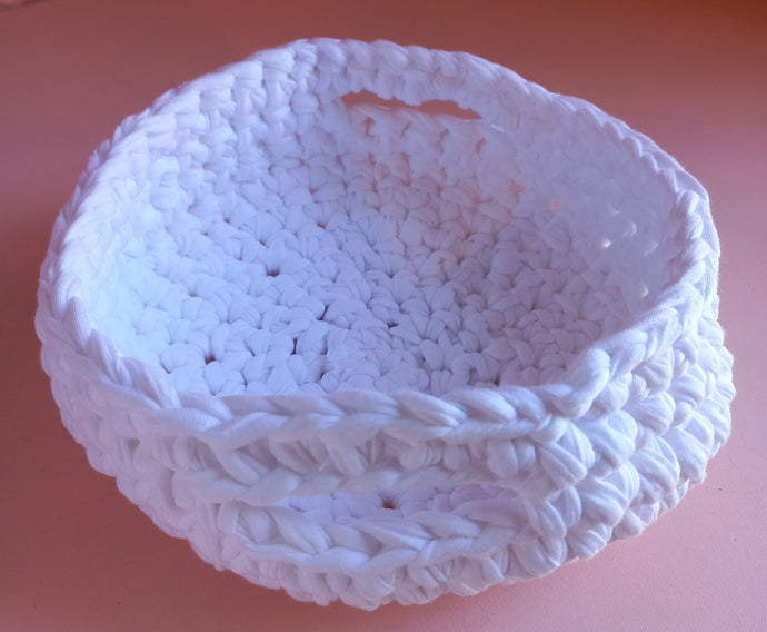 white crochet basket with handles