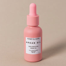 Load image into Gallery viewer, argan oil in pink bottle
