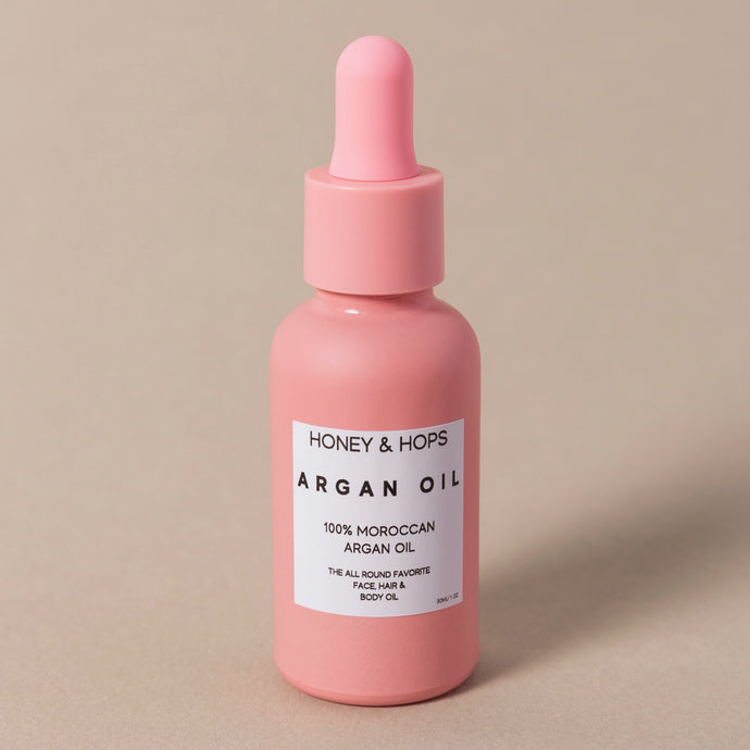 argan oil in pink bottle